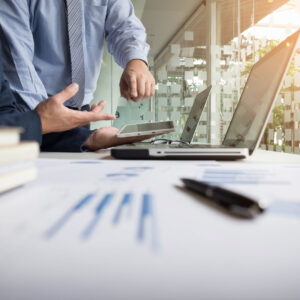 business adviser analyzing financial figures denoting the progress in the work of the company scaled